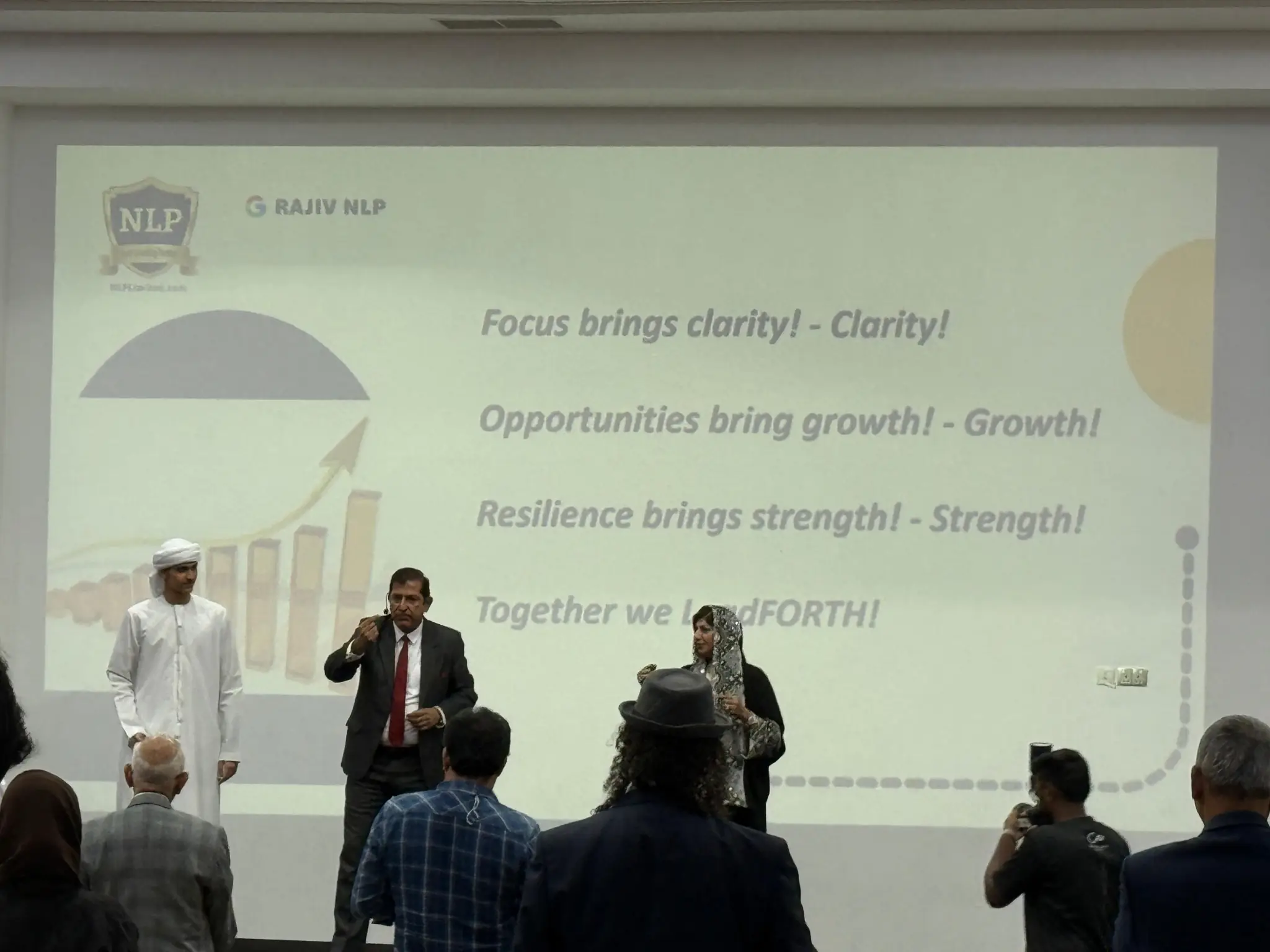 Rajiv Sharma delivering leadership development on stage for the LeadFORTH programme
